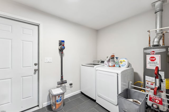 112 Drexel Ave, Egg Harbor Township, NJ 08234 - washroom with separate washer and dryer, gas water heater, dark tile patterned floors, and baseboards