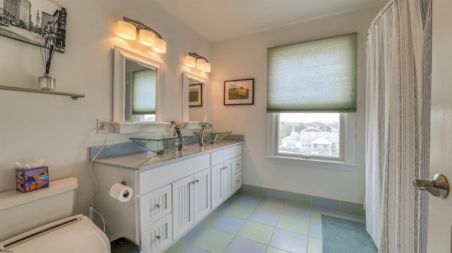 8201 Amherst, Margate, NJ 08401 - full bathroom with vanity, toilet, and baseboards
