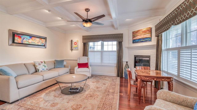 8201 Amherst, Margate, NJ 08401 - living room with wood finished floors, beam ceiling, a ceiling fan, coffered ceiling, and a large fireplace