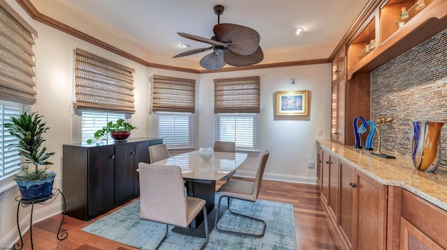 8201 Amherst, Margate, NJ 08401 - dining room with a ceiling fan, baseboards, wood finished floors, and crown molding