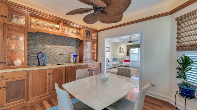 8201 Amherst, Margate, NJ 08401 - dining room with a ceiling fan, dark wood-style flooring, ornamental molding, baseboards, and wet bar