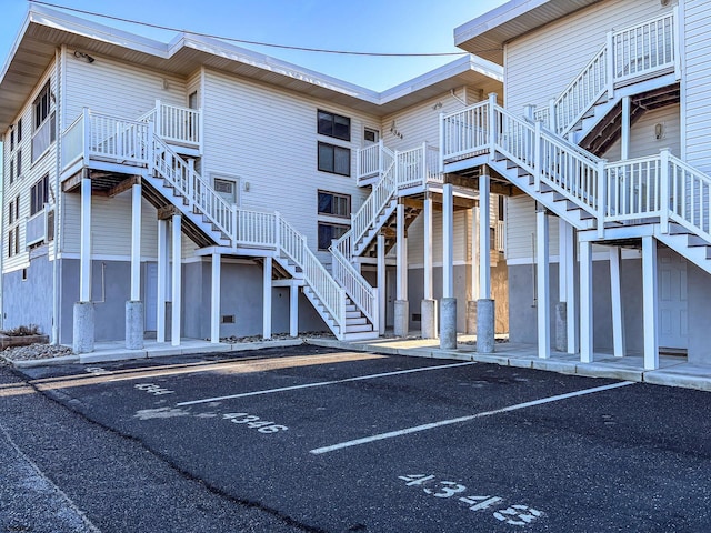 4344 W Ave Unit 26, Ocean City, NJ 08226 - view of building exterior with stairs and uncovered parking