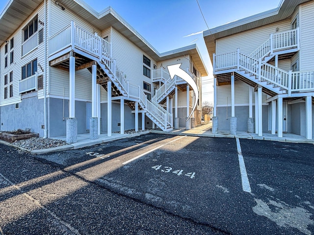 4344 W Ave Unit 26, Ocean City, NJ 08226 - view of building exterior with uncovered parking and stairway