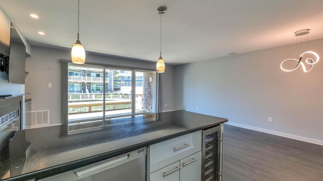 903 Harbour Cv Unit 903, Somers Point, NJ 08244 - kitchen with beverage cooler, dark countertops, dark wood-style flooring, recessed lighting, and hanging light fixtures