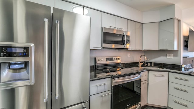 903 Harbour Cv Unit 903, Somers Point, NJ 08244 - kitchen featuring stainless steel appliances, a sink, gray cabinets, and dark stone countertops