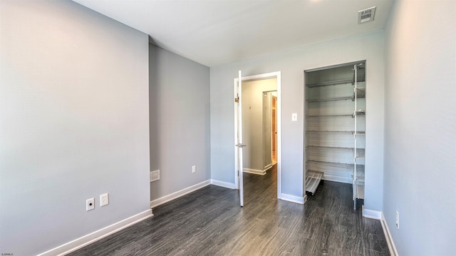 903 Harbour Cv Unit 903, Somers Point, NJ 08244 - unfurnished bedroom featuring dark wood-style flooring, baseboards, and a closet