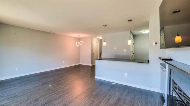 903 Harbour Cv Unit 903, Somers Point, NJ 08244 - unfurnished living room with dark wood finished floors and baseboards