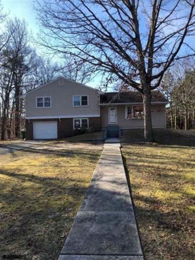 55 Atlas Lane Rd, Egg Harbor Township, NJ 08234 - tri-level home with a garage and a front lawn