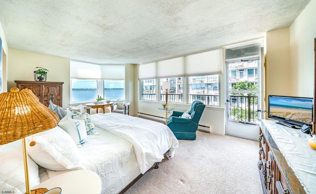 500 Bay Ave Unit 404South, Ocean City, NJ 08226 - carpeted bedroom with a textured ceiling, a baseboard radiator, and access to outside
