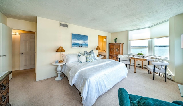 500 Bay Ave Unit 404South, Ocean City, NJ 08226 - bedroom with carpet floors, a textured ceiling, baseboards, and a baseboard radiator
