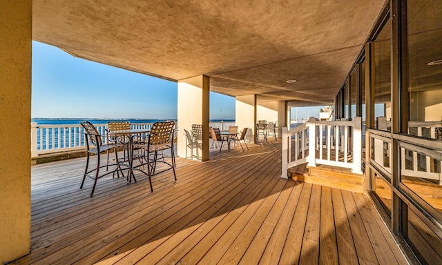 500 Bay Ave Unit 404South, Ocean City, NJ 08226 - wooden deck featuring a water view and outdoor dining space