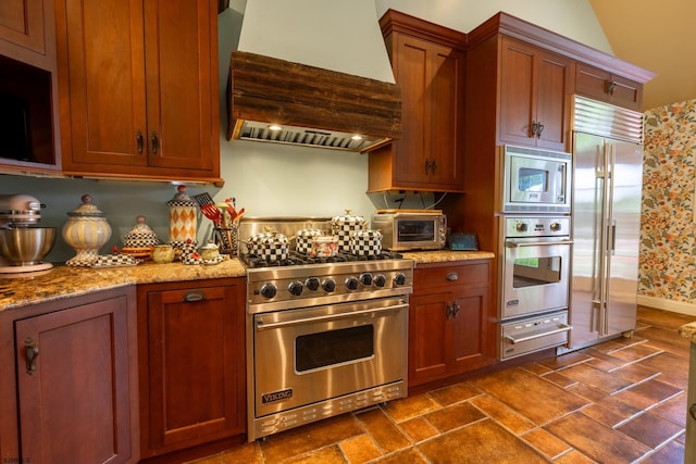 622 Central Ave, Linwood, NJ 08221 - kitchen featuring built in appliances, premium range hood, a warming drawer, light stone countertops, and brown cabinetry