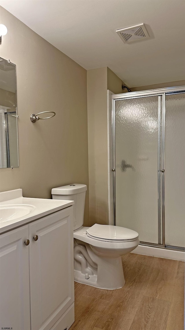 21 Heather Croft Unit 21, Egg Harbor Township, NJ 08234 - full bathroom featuring toilet, wood finished floors, a shower stall, and vanity