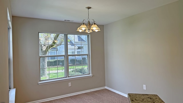 21 Heather Croft Unit 21, Egg Harbor Township, NJ 08234 - carpeted empty room with a chandelier and baseboards