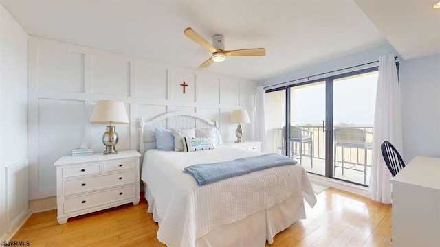 4540 W Brigantine Ave Unit N208, Brigantine, NJ 08203 - bedroom with access to exterior, light wood-type flooring, a decorative wall, and ceiling fan