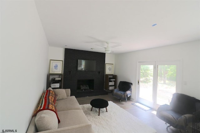 200 Linda Ln, Galloway Township, NJ 08205 - living area with light wood-style floors, ceiling fan, and a fireplace