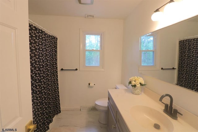 200 Linda Ln, Galloway Township, NJ 08205 - bathroom featuring toilet, vanity, healthy amount of natural light, and marble look tiles