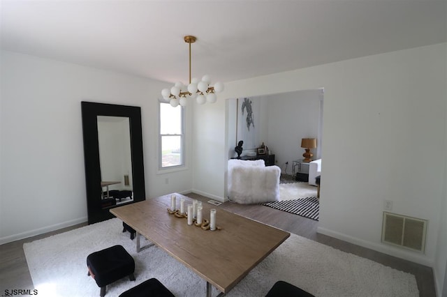 200 Linda Ln, Galloway Township, NJ 08205 - dining space featuring a chandelier, wood finished floors, and baseboards
