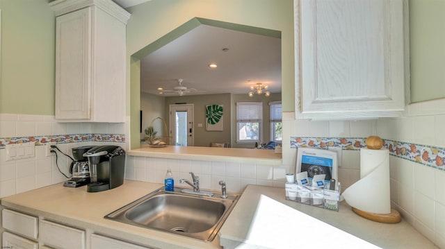 1318 Ocean Ave Unit 1318, Ocean City, NJ 08226 - kitchen featuring a sink, light countertops, decorative backsplash, and recessed lighting