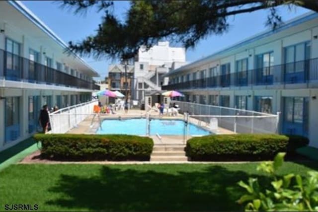 3501 Boardwalk Unit A228, Atlantic City, NJ 08401 - community pool featuring a yard