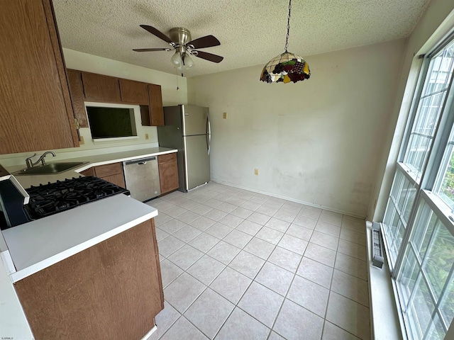 232 E Colman Pl, Galloway Township, NJ 08205 - kitchen with stainless steel appliances, a textured ceiling, light countertops, light tile patterned flooring, and a ceiling fan