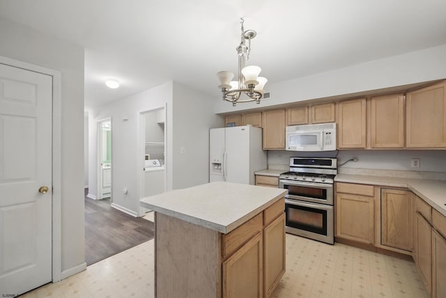 101 Sycamore Ave, Egg Harbor Township, NJ 08234 - kitchen with white appliances, light floors, a chandelier, light countertops, and pendant lighting