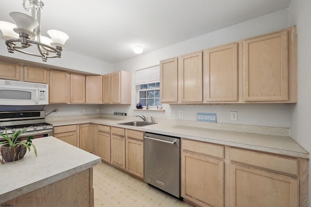 101 Sycamore Ave, Egg Harbor Township, NJ 08234 - kitchen with light brown cabinets, appliances with stainless steel finishes, a chandelier, and a sink