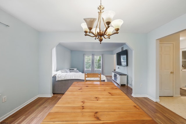 101 Sycamore Ave, Egg Harbor Township, NJ 08234 - bedroom featuring wood finished floors, arched walkways, a chandelier, and baseboards
