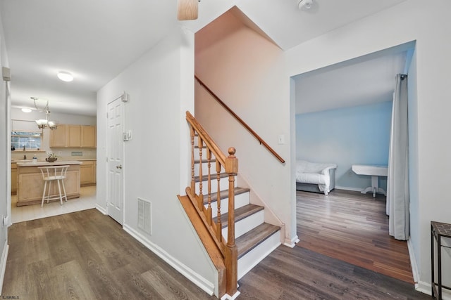 101 Sycamore Ave, Egg Harbor Township, NJ 08234 - stairway featuring wood finished floors, a chandelier, and baseboards