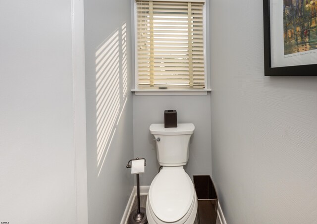 608 Delavan Ave, Margate, NJ 08402 - bathroom featuring baseboards and toilet