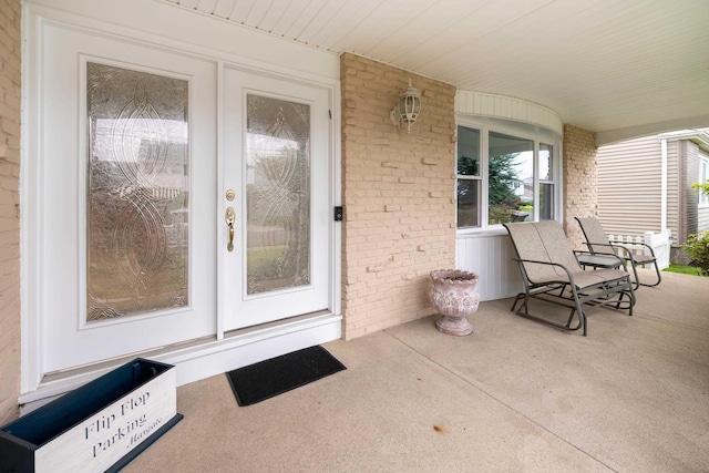 608 Delavan Ave, Margate, NJ 08402 - property entrance featuring covered porch and brick siding