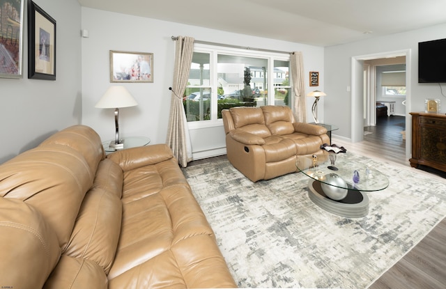 608 Delavan Ave, Margate, NJ 08402 - living area featuring wood finished floors and a baseboard radiator