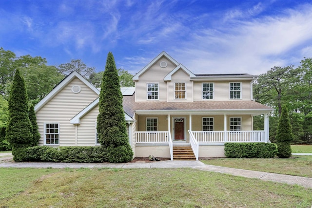 2511 Long Ave, Mays Landing, NJ 08330 - view of front facade with covered porch, a front yard, and solar panels