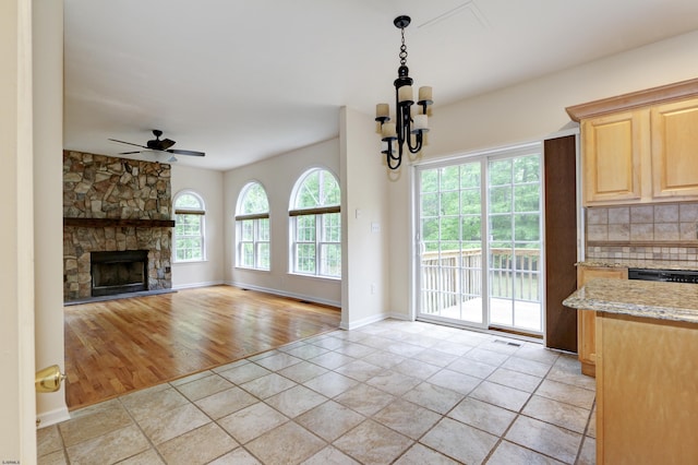 2511 Long Ave, Mays Landing, NJ 08330 - unfurnished living room featuring ceiling fan, a chandelier, a fireplace, light wood-style flooring, and baseboards