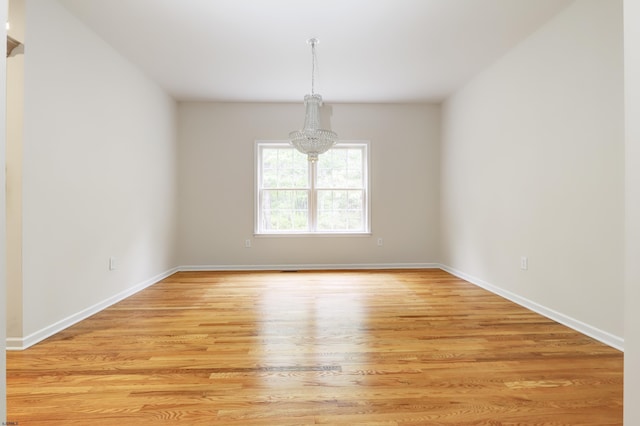 2511 Long Ave, Mays Landing, NJ 08330 - empty room with a chandelier, light wood-style floors, and baseboards