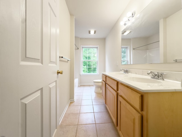 2511 Long Ave, Mays Landing, NJ 08330 - bathroom featuring toilet, double vanity, tile patterned floors, baseboards, and washtub / shower combination