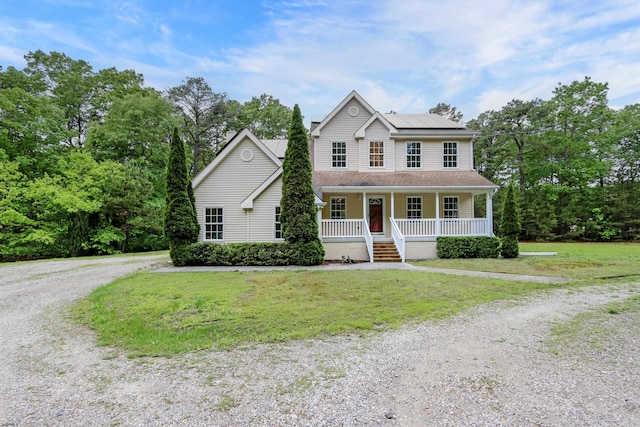 2511 Long Ave, Mays Landing, NJ 08330 - view of front of house with covered porch, gravel driveway, a front lawn, and roof mounted solar panels
