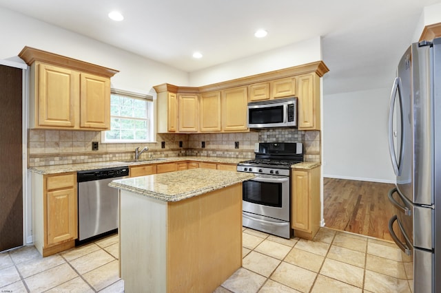 2511 Long Ave, Mays Landing, NJ 08330 - kitchen featuring stainless steel appliances, light brown cabinetry, a sink, light stone countertops, and a center island