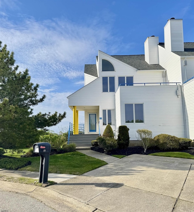13 Delmar Ln, Brigantine, NJ 08203 - view of front of property with a porch and roof with shingles