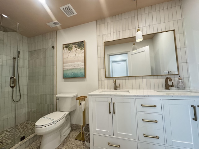 13 Delmar Ln, Brigantine, NJ 08203 - bathroom featuring toilet, a shower stall, speckled floor, double vanity, and decorative backsplash