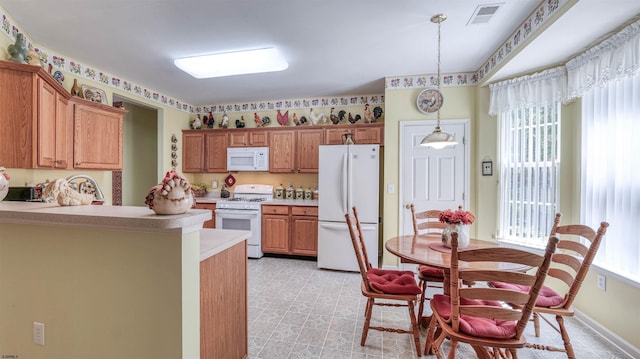 50 Derby Dr, Galloway Township, NJ 08205 - kitchen featuring white appliances, light countertops, light flooring, a peninsula, and hanging light fixtures