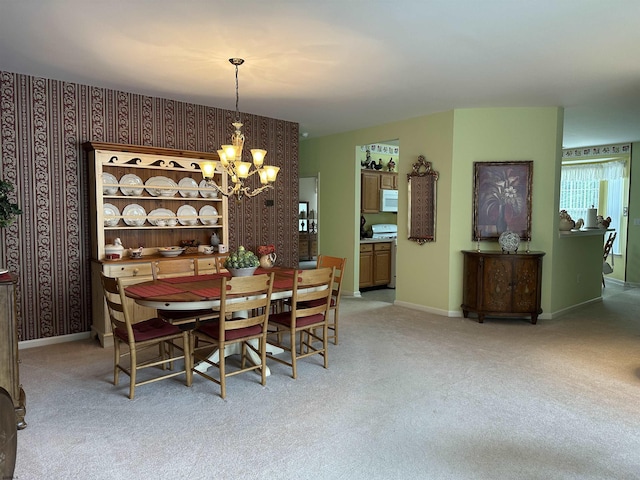 50 Derby Dr, Galloway Township, NJ 08205 - dining space with a chandelier, wallpapered walls, light colored carpet, and baseboards