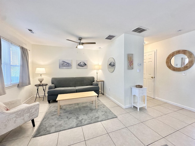 251 38th St, Brigantine, NJ 08203 - living area featuring light tile patterned flooring, ceiling fan, and baseboards