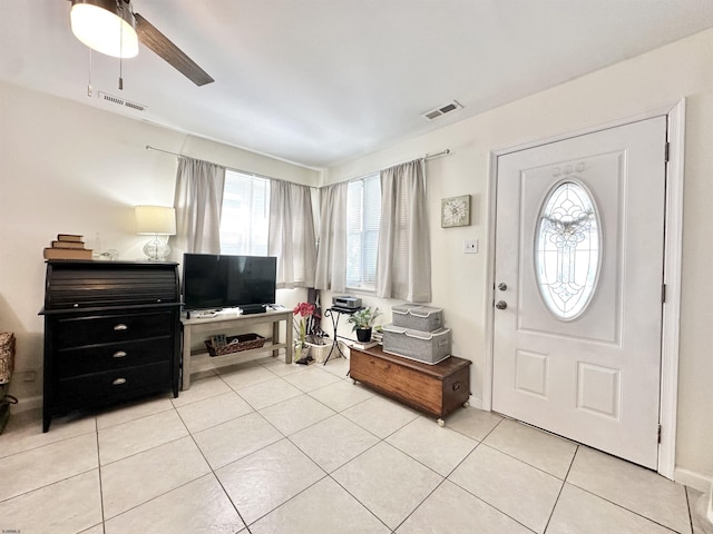 251 38th St, Brigantine, NJ 08203 - foyer entrance featuring light tile patterned floors and a ceiling fan