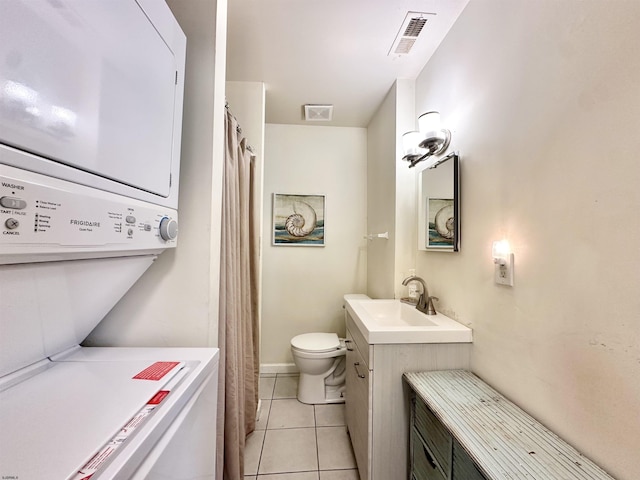 251 38th St, Brigantine, NJ 08203 - bathroom with stacked washer / drying machine, toilet, vanity, and tile patterned floors