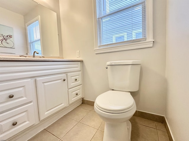 251 38th St, Brigantine, NJ 08203 - half bathroom featuring baseboards, tile patterned flooring, vanity, and plenty of natural light
