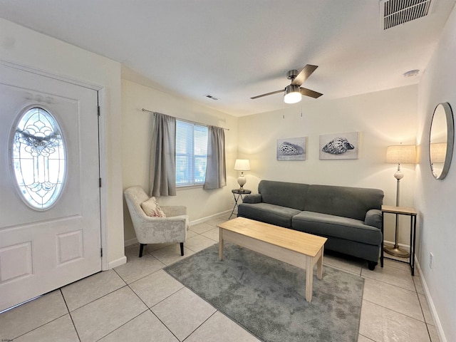 251 38th St, Brigantine, NJ 08203 - living room with healthy amount of natural light, light tile patterned flooring, and a ceiling fan