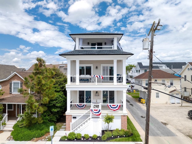 305 15th St, Ocean City, NJ 08226 - view of front of home featuring a balcony, covered porch, roof with shingles, and stairs