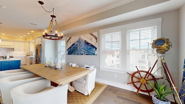 305 15th St, Ocean City, NJ 08226 - dining room with a chandelier, wood finished floors, baseboards, recessed lighting, and ornamental molding