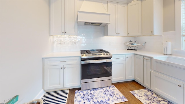 305 15th St, Ocean City, NJ 08226 - kitchen featuring gas stove, custom exhaust hood, light countertops, and white cabinetry